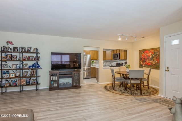 dining room featuring light hardwood / wood-style flooring