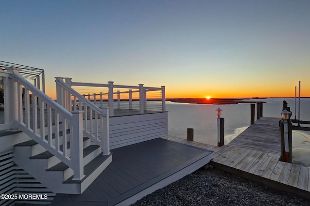 dock area featuring a water view and stairs