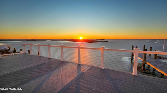 dock area with a deck with water view