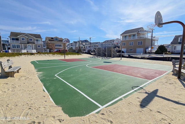 view of sport court featuring community basketball court and a residential view