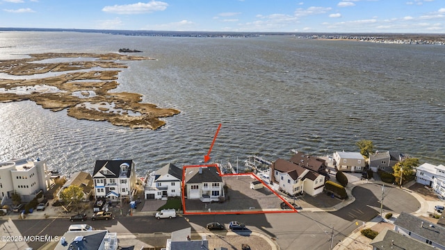 birds eye view of property featuring a residential view and a water view