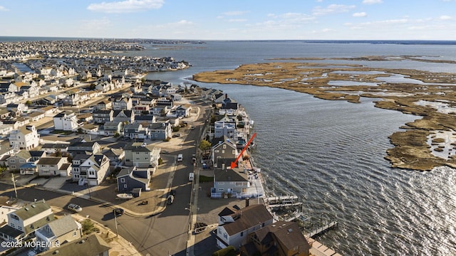 bird's eye view with a residential view and a water view