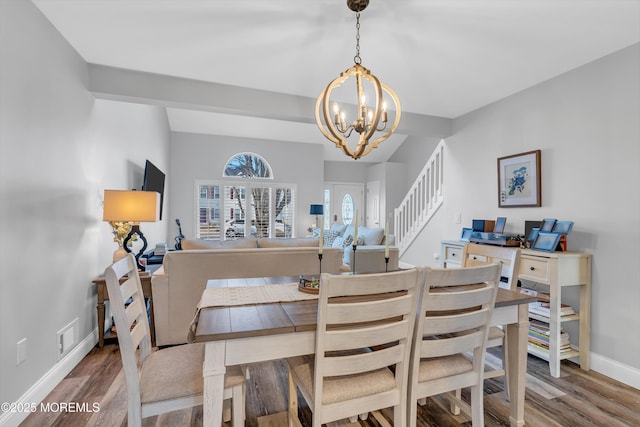 dining room with a chandelier and wood-type flooring