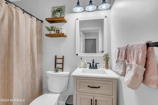 bathroom with toilet and vanity