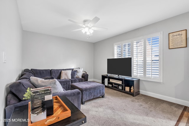 carpeted living room with ceiling fan