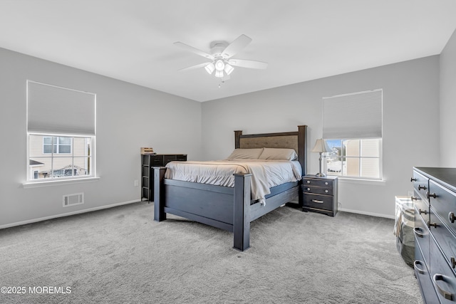 bedroom with ceiling fan and light colored carpet