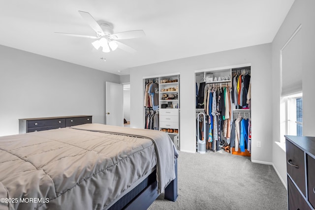 bedroom with carpet flooring, ceiling fan, and multiple closets