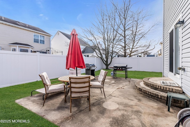 view of patio featuring a grill