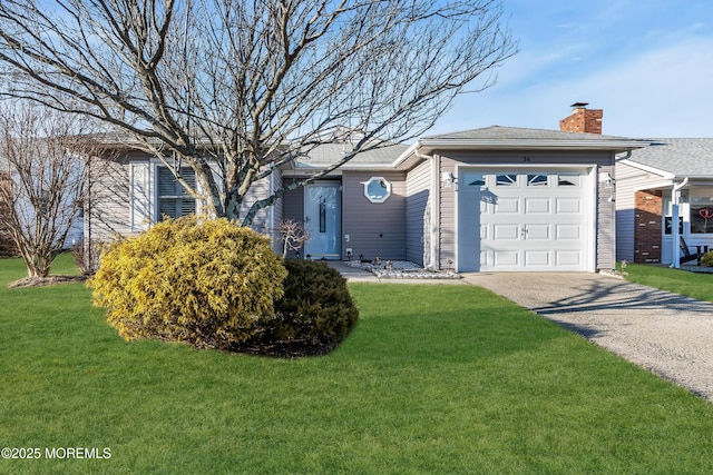 ranch-style house with a front yard and a garage