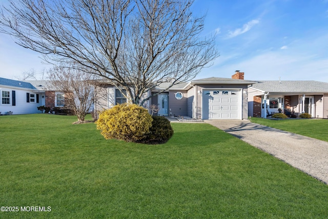 ranch-style house with a garage and a front yard