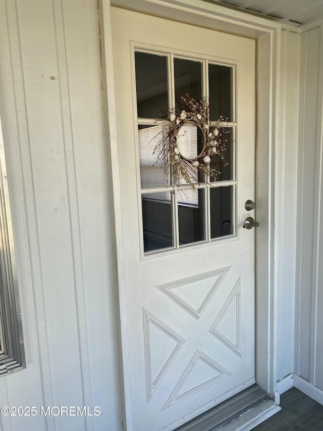 property entrance with board and batten siding