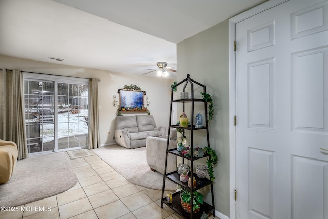 interior space with ceiling fan