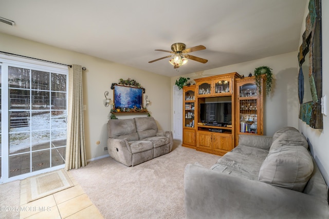 carpeted living room featuring ceiling fan