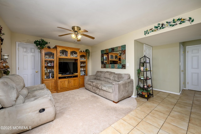 tiled living room with ceiling fan