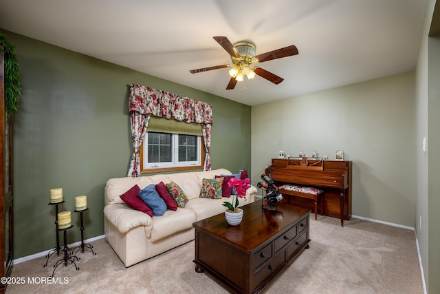 carpeted living room featuring ceiling fan