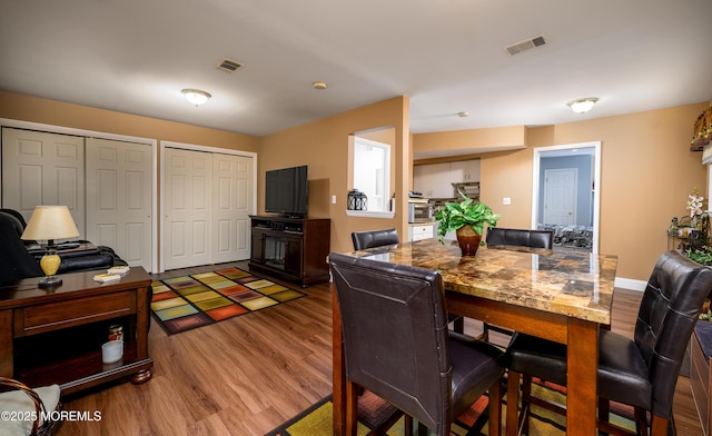 dining area featuring wood-type flooring