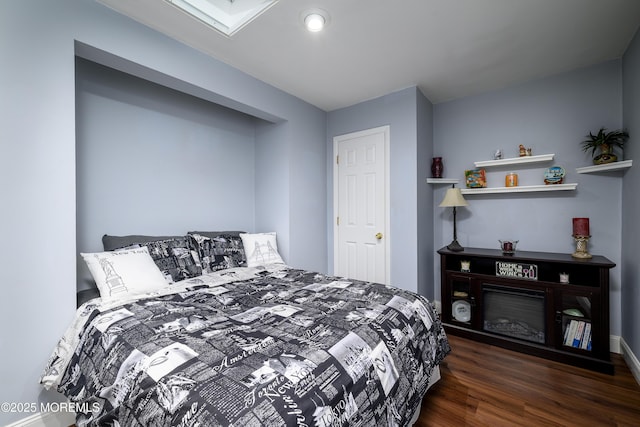 bedroom featuring dark wood-type flooring