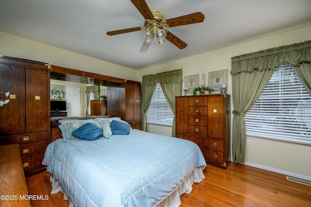 bedroom featuring ceiling fan and light hardwood / wood-style floors