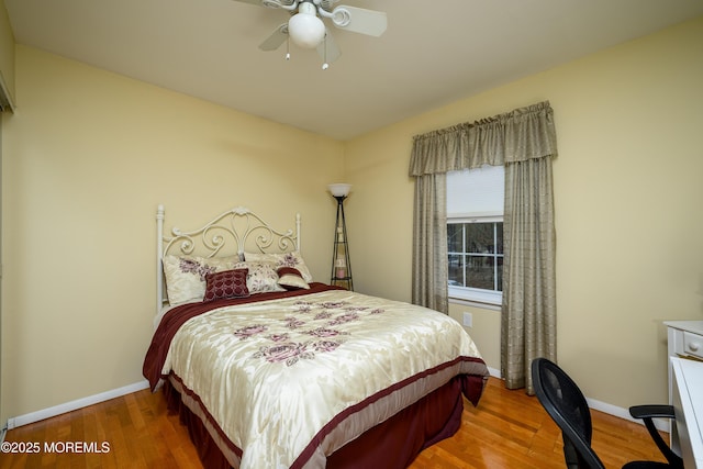 bedroom featuring hardwood / wood-style floors and ceiling fan