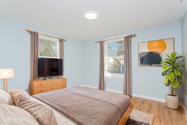 bedroom featuring light wood-type flooring