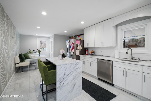 67 Grand Ave, Toms River, NJ 08753 - kitchen featuring appliances with stainless steel finishes, marble finish floor, white cabinetry, and a sink