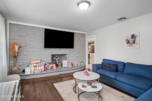 67 Grand Ave, Toms River, NJ 08753 - living room featuring a fireplace, wood finished floors, and visible vents