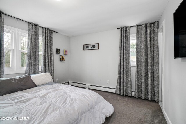 67 Grand Ave, Toms River, NJ 08753 - bedroom featuring a baseboard heating unit, multiple windows, dark carpet, and baseboards