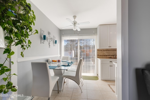 dining area with ceiling fan and light tile patterned floors