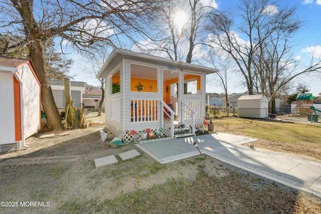 view of front facade featuring a storage shed