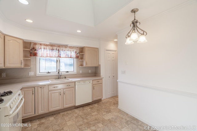 kitchen featuring white appliances, pendant lighting, sink, and light brown cabinets