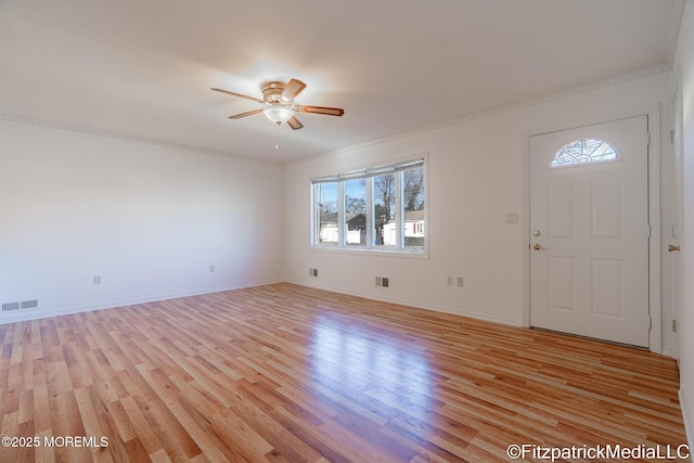 foyer with ceiling fan and light hardwood / wood-style flooring