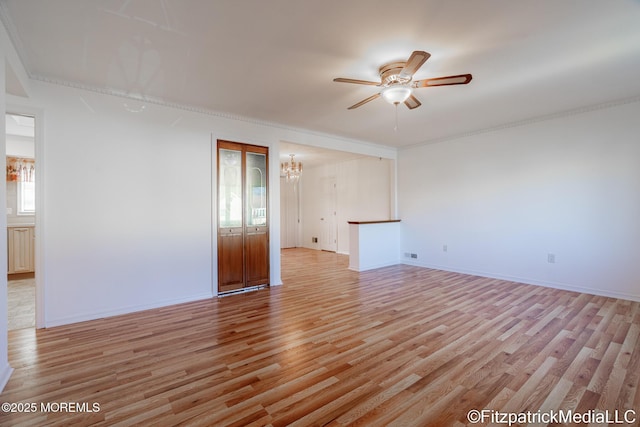 unfurnished room with light wood-type flooring and ceiling fan