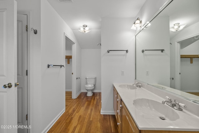 200 2nd Ave Unit 14, Belmar, NJ 07719 - bathroom with double vanity, wood finished floors, baseboards, and toilet