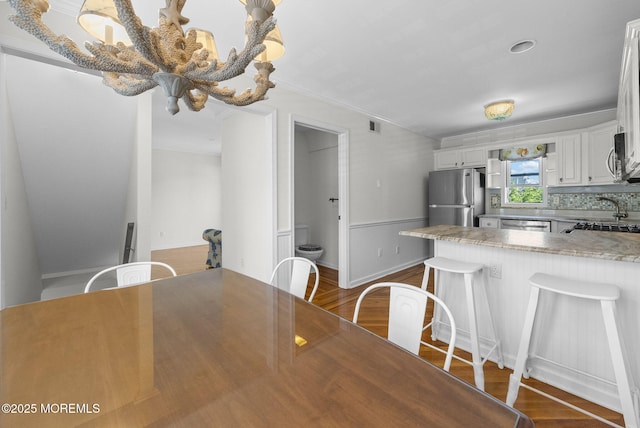 200 2nd Ave Unit 14, Belmar, NJ 07719 - dining space featuring dark wood-type flooring, ornamental molding, and baseboards