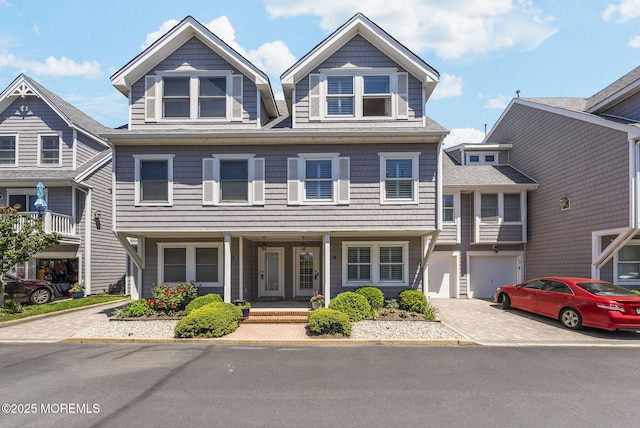 200 2nd Ave Unit 14, Belmar, NJ 07719 - townhome / multi-family property featuring decorative driveway, a porch, and a garage