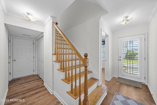 200 2nd Ave Unit 14, Belmar, NJ 07719 - foyer entrance featuring wood finished floors, crown molding, stairway, and baseboards