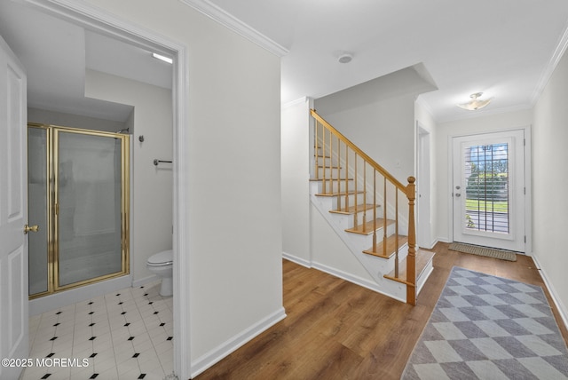 200 2nd Ave Unit 14, Belmar, NJ 07719 - foyer featuring crown molding, stairs, baseboards, and wood finished floors