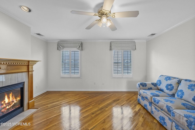 200 2nd Ave Unit 14, Belmar, NJ 07719 - living room with a tiled fireplace, crown molding, wood finished floors, ceiling fan, and baseboards