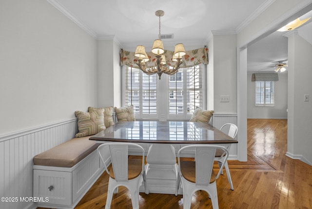 200 2nd Ave Unit 14, Belmar, NJ 07719 - dining space featuring a chandelier, crown molding, wood finished floors, and ceiling fan