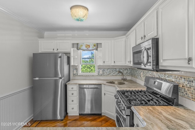 200 2nd Ave Unit 14, Belmar, NJ 07719 - kitchen with stainless steel appliances, a sink, light countertops, decorative backsplash, and white cabinetry