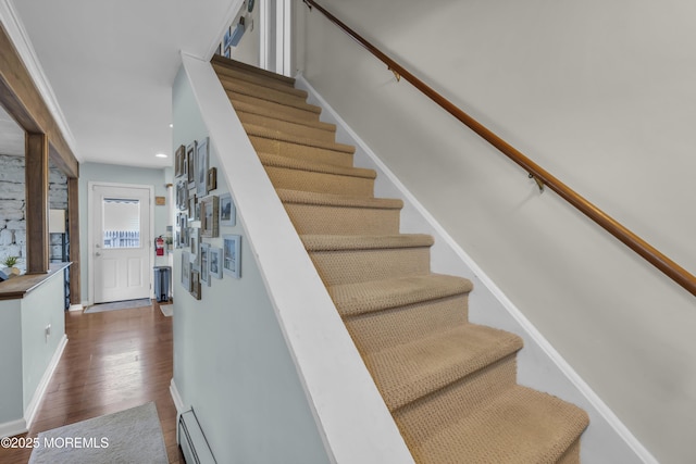 stairs with baseboards, recessed lighting, and wood finished floors