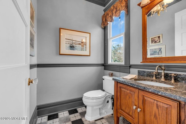 bathroom featuring vanity, toilet, and tile patterned floors