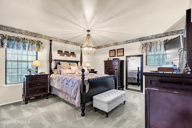 bedroom with a chandelier and carpet floors