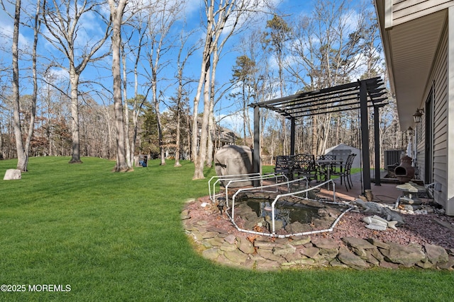 view of yard with a pergola and a patio area