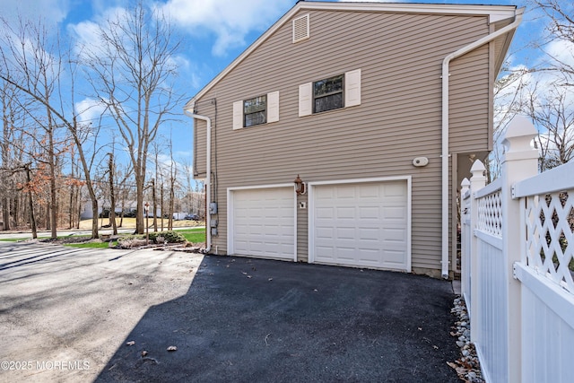 view of side of home with a garage