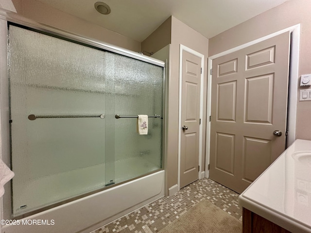 full bathroom featuring enclosed tub / shower combo and vanity