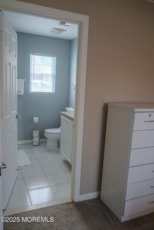 bathroom with toilet and vanity