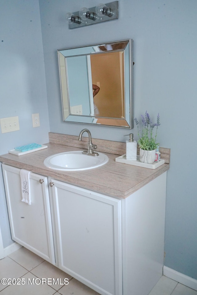 bathroom featuring tile patterned floors and vanity