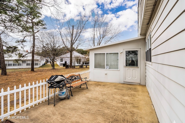 exterior space featuring a patio area and fence