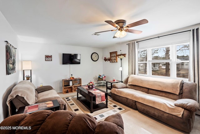 living area with ceiling fan and visible vents